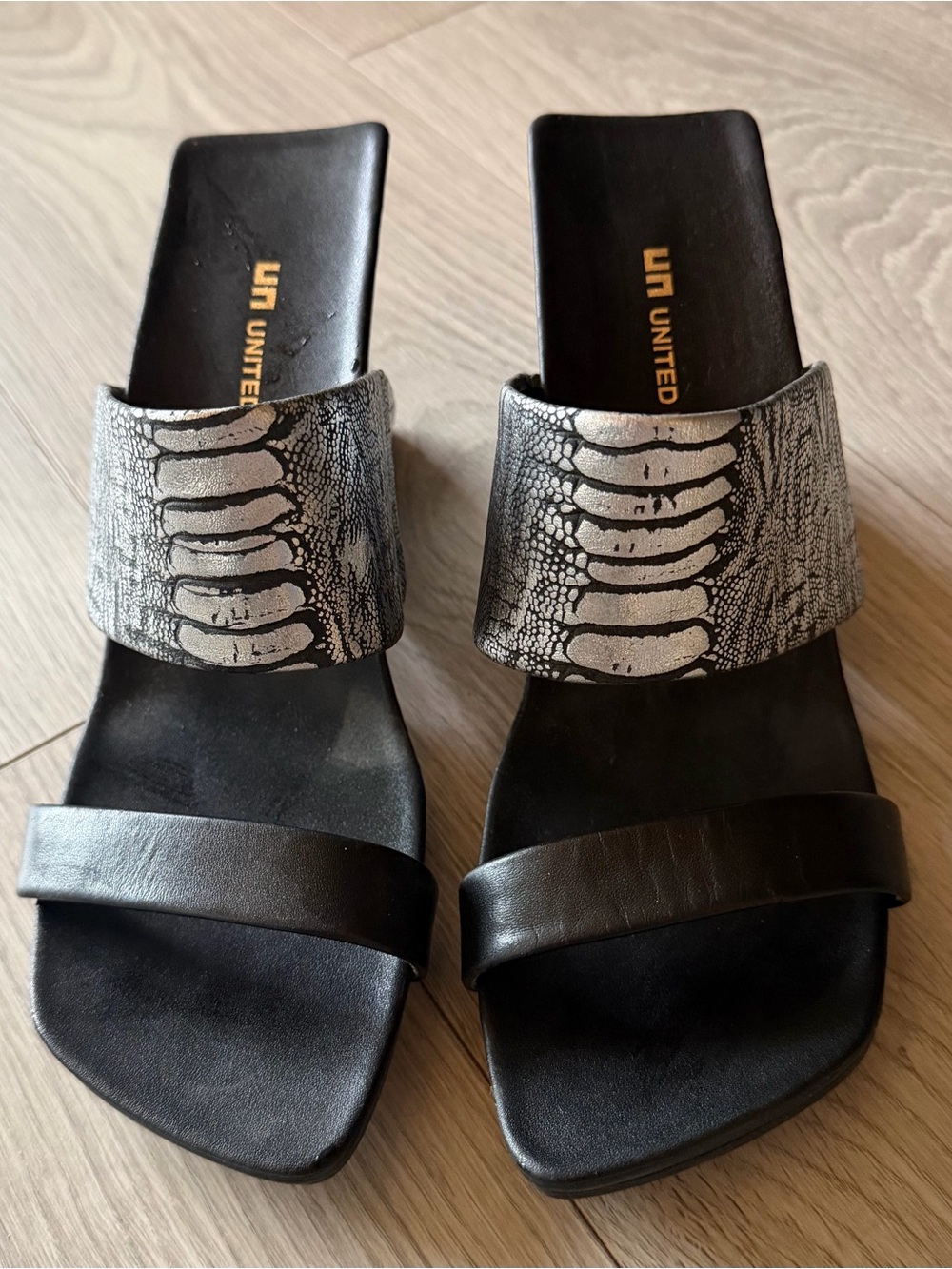 United Nude Black Slide Sandal with Silver Snake-Print Strap
3 1/2” high